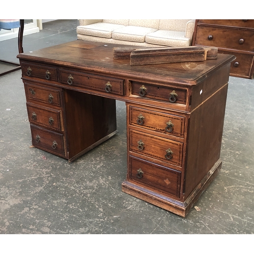 740 - A late Victorian pine pedestal desk (af), having an arrangement of nine drawers, 121x59x73cmH