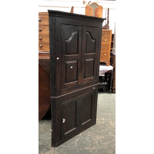 750 - A George III standing oak corner cupboard, 102x177cmH