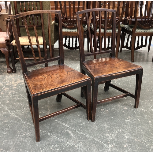 753 - A pair of provincial 18th century side chairs, each with four vertical splats and elm seats