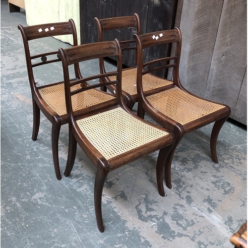 764 - A set of four Regency style caned side chairs, with swept legs