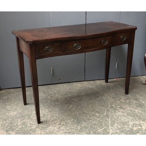 797 - A Serpentine mahogany serving table, with three frieze drawers, on square tapered legs, 118x49x79cmH