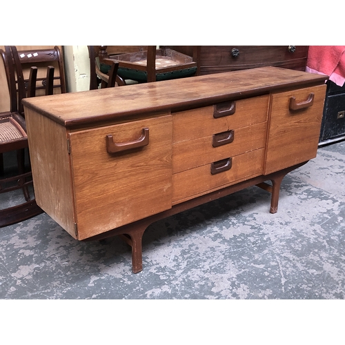 801 - A mid century teak sideboard, with three drawers flanked by cupboards, 151x40x75cmH