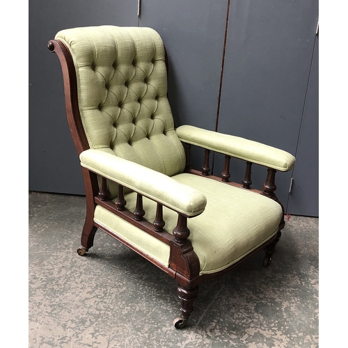 802 - A Victorian buttonback armchair, with turned underarm supports, 71cmW