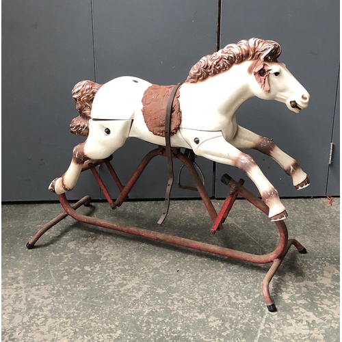 803 - A rocking horse on a metal base, 82cmL