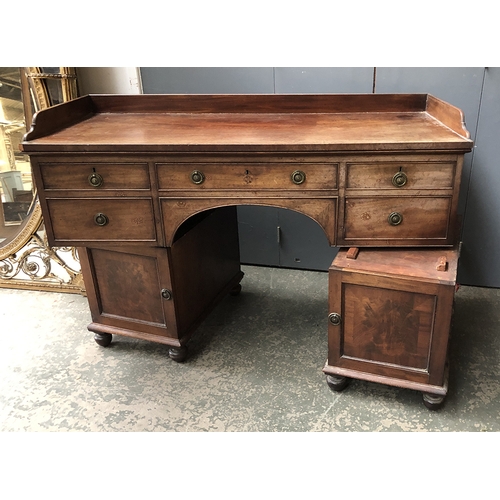 805 - A Victorian kneehole desk, three quarter gallery top, over and arrangement of five drawers with cupb... 