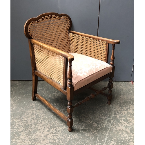 807 - A caned oak bergere armchair, 61cmW