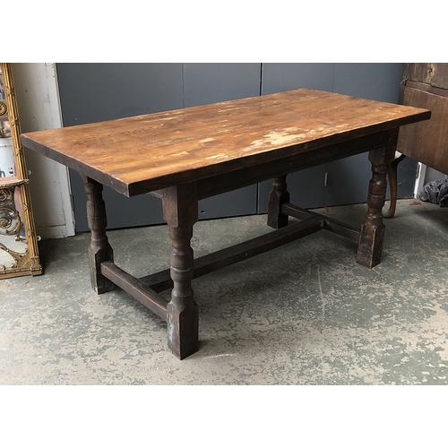 808 - An oak and elm kitchen table, on block turned legs and H stretcher, 161x80x73cmH