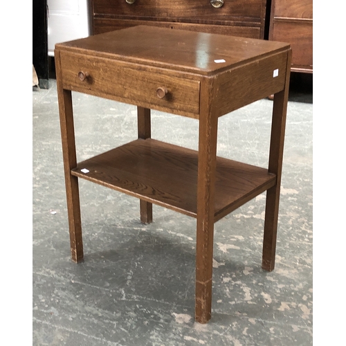 745 - A mid century oak occasional table with single drawer and undershelf, 69.5cmH