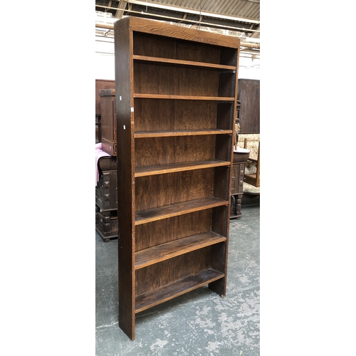 763 - A tall oak bookcase with seven shelves, originally adjustable, 92cmW