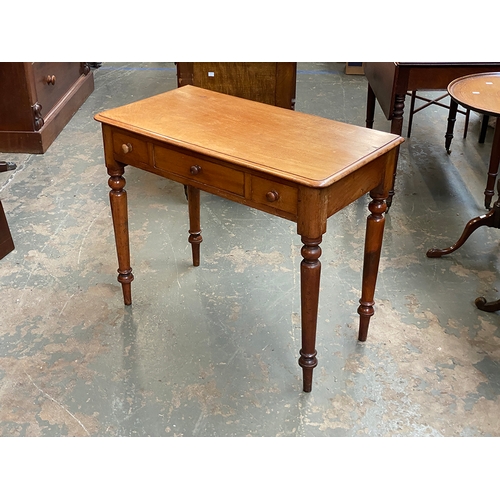 777 - A 19th century pale mahogany side table, with three frieze drawers, on turned tapering legs, 92x46x7... 