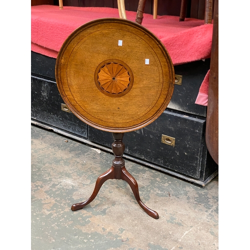 780 - A 19th century tripod table, dished tilt top, with central fan patera, on turned column and tripod c... 