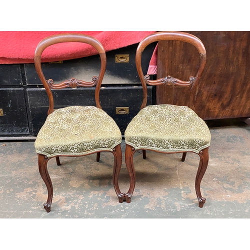 782 - A pair of Victorian balloon back rosewood sideachairs, carved midrails, button upholstered stuffover... 