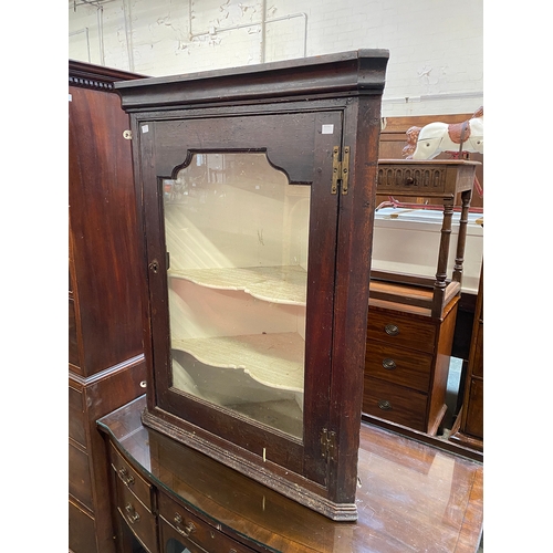 785 - A glazed oak corner cupboard, 98cmH