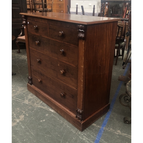 773 - A Victorian mahogany chest of two short over three graduating drawers, flanked by carved pillasters,... 