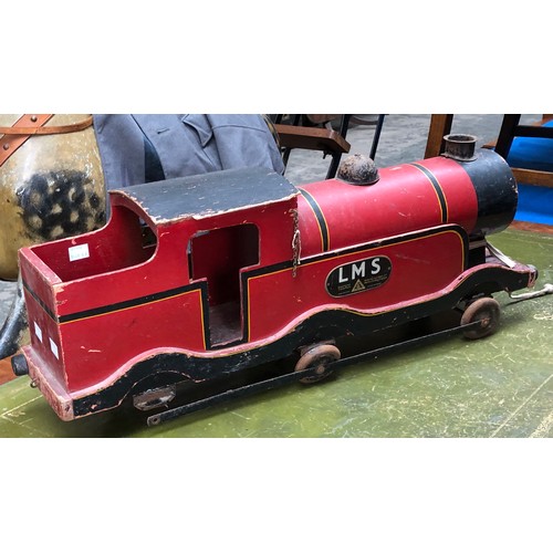 809 - A painted wooden LMS model steam train, 70cmL