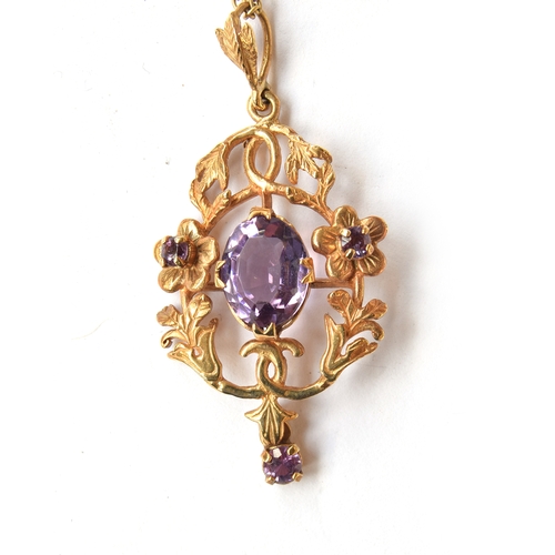 105 - A 9ct gold foliate pendant set with amethysts with a lavalier drop, on a 9ct gold chain, the chain 4... 