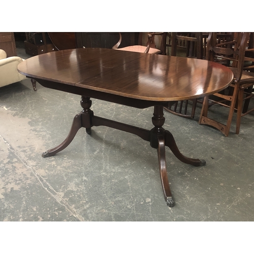 772A - A reproduction mahogany D end dining table in Regency style