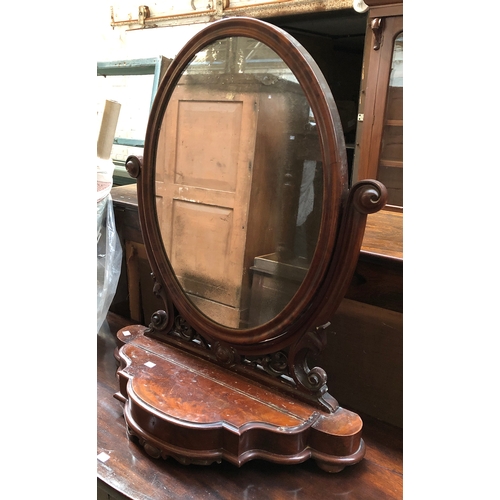 796 - A Victorian oval adjustable dressing mirror, 81cmH