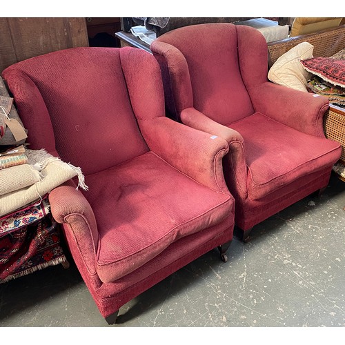 634 - A pair of good country house wingback armchairs with feather filled cushions, on square tapered legs... 