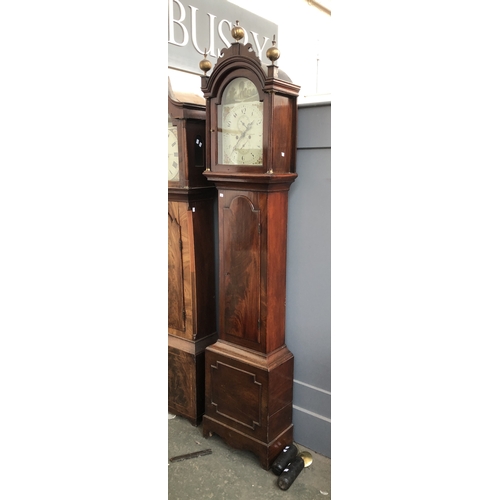 828 - A mahogany longcase clock, with three ball finials over a domed painted dial, signed Noakes Burwash