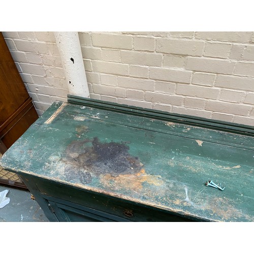 799 - A massive Victorian country house pine kitchen dresser painted green, the rack with four shelves ove... 