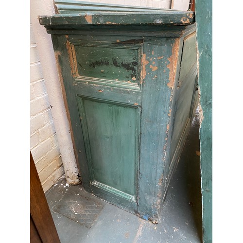 799 - A massive Victorian country house pine kitchen dresser painted green, the rack with four shelves ove... 