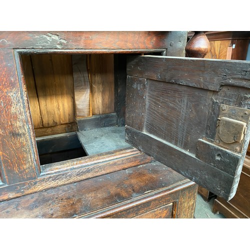 621 - An oak court cupboard, first half 18th century, the central panel inscribed WHM 1732, 154cm high, 14... 