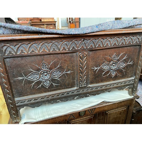 648 - A 17th century and later carved to panel oak coffer, 122cm wide, 55cm deep, 66cm high