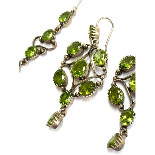 52 - A vintage silver and peridot necklace with two matching pairs of earrings, the longer pair 6.5cmL, t... 