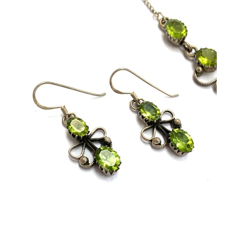 52 - A vintage silver and peridot necklace with two matching pairs of earrings, the longer pair 6.5cmL, t... 