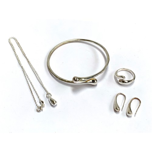 50 - A 925 silver crossover bangle with matching earrings, ring and pendant on chain, gross weight 32.4g