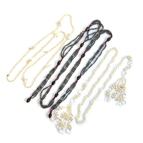 55 - Two long wrap necklaces, one strung with peacock coloured cultured pearls, garnet beads and smoky qu... 