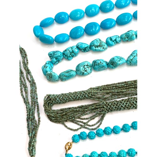 44 - A quantity of turquoise coloured beaded jewellery to include heavy dyed howlite tumbled stone neckla... 