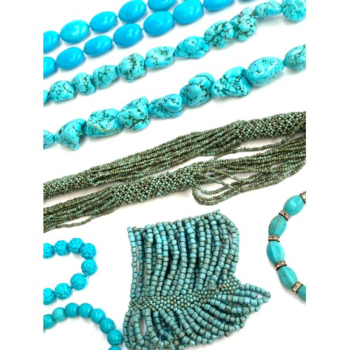 44 - A quantity of turquoise coloured beaded jewellery to include heavy dyed howlite tumbled stone neckla... 