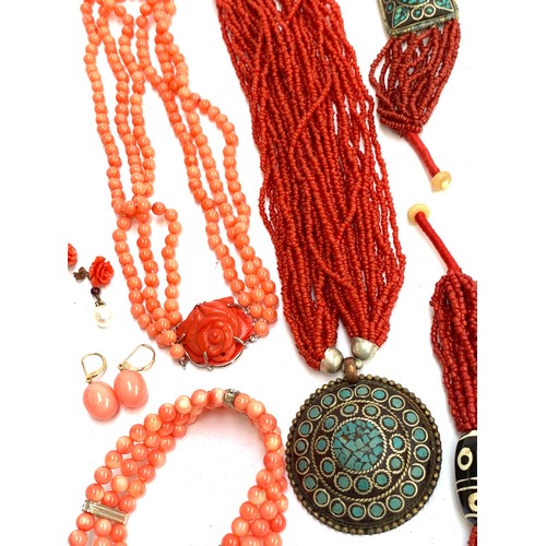 45 - A large quantity of coral and coral coloured bead necklaces and bracelets, to include branch coral, ... 