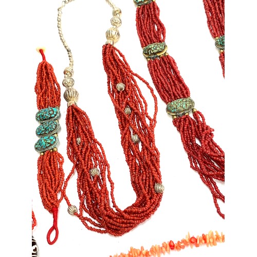 45 - A large quantity of coral and coral coloured bead necklaces and bracelets, to include branch coral, ... 