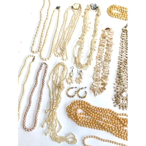 48 - A large quantity of mainly cultured pearl necklaces, some with 925 silver clasps, approx. 30 necklac... 