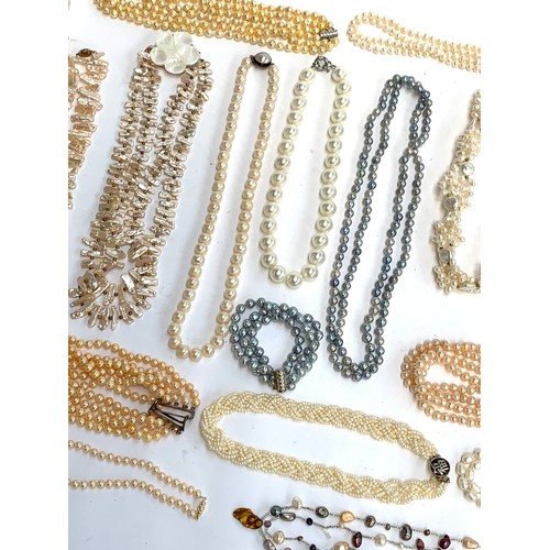 48 - A large quantity of mainly cultured pearl necklaces, some with 925 silver clasps, approx. 30 necklac... 