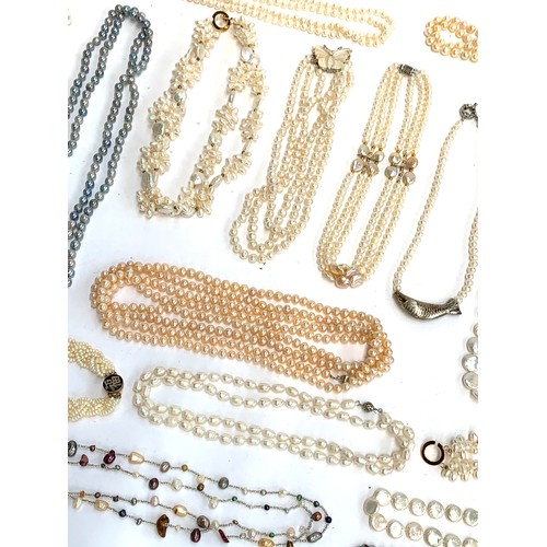 48 - A large quantity of mainly cultured pearl necklaces, some with 925 silver clasps, approx. 30 necklac... 