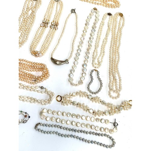 48 - A large quantity of mainly cultured pearl necklaces, some with 925 silver clasps, approx. 30 necklac... 