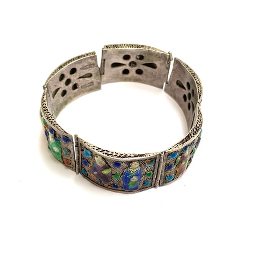 56 - An unusual Chinese export silver and enamel panel bracelet (af), in need of repair, 18cmL; together ... 