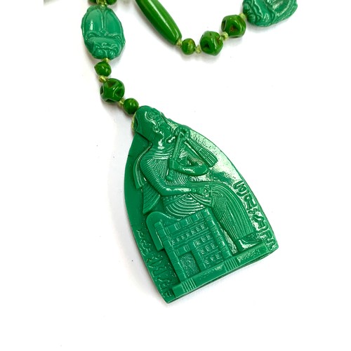 60 - An Art Deco Czech Neiger Brothers pressed glass bead Egyptian revival necklace with pharaoh pendant ... 