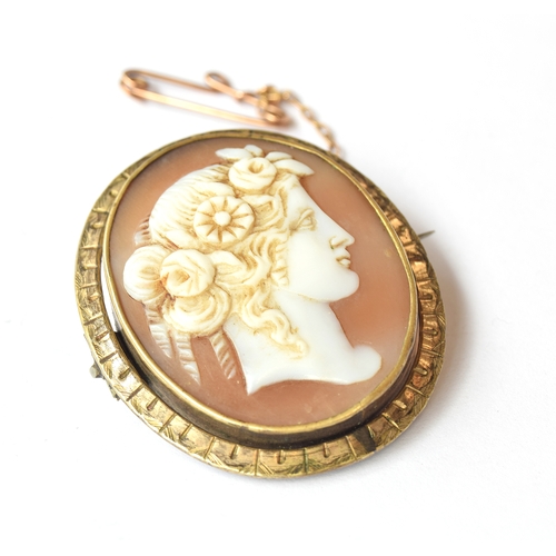 101 - A late Victorian gilt metal mounted well carved shell cameo of the goddess Flora, with a gold safety... 