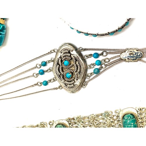 68 - A quantity of Mexican and Egyptian white metal jewellery, some set with turquoise, faience scarabs a... 