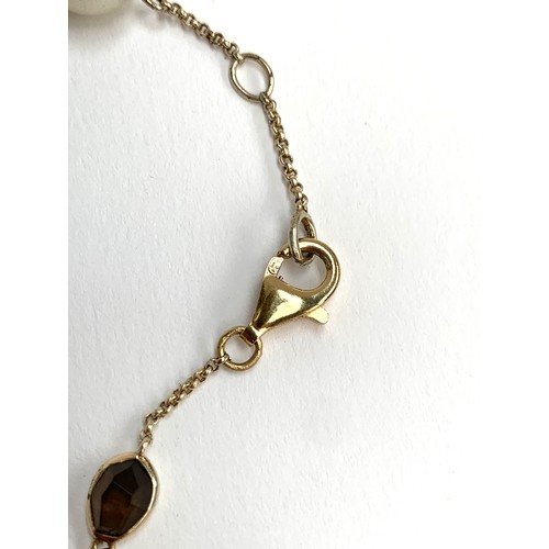 70 - A silver station chain interspersed with cultured pearls and agate, fastening with a 9ct gold clasp,... 