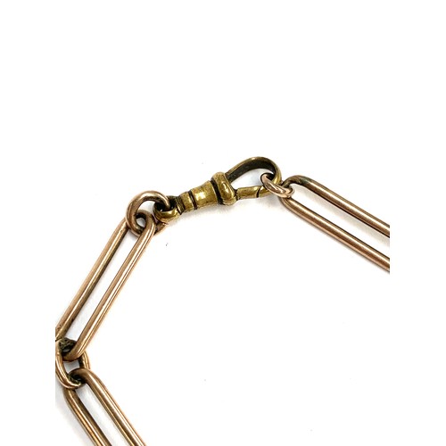 75 - A yellow metal trombone link fob chain, with T bar and brass dog clip, 31.5cmL, 23.5g gross weight