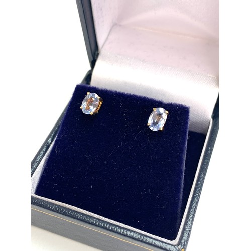 79 - A pair of 9ct gold blue topaz stud earrings, 0.5cmL, 1.2g gross weight