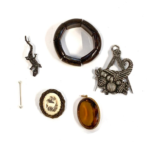 103 - A mixed lot of jewellery to include a 19th century cut steel salamander brooch; large Masonic white ... 