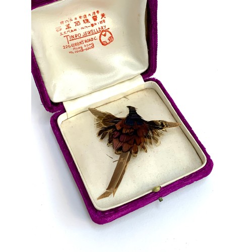 116 - A vintage Chinese pheasant feather brooch, 8cmL, in original purple velvet box for Tinpo Jewellery, ... 