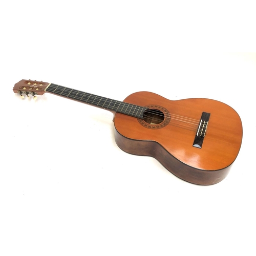 1390 - A Suzuki classical guitar, one string broken